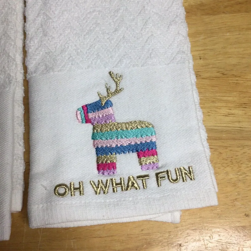 2 festive‎ holiday towel sparkly reindeer piñata and the words Oh What Fun